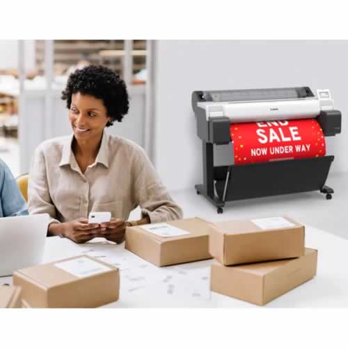 Canon TM-340 Printer printing a POS poster in the background with a woman packing retail boxes for dispatch